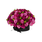 Bouquet of pink roses in a black box on a white background