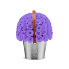 Basket filled with purple roses on a white background