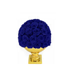 Bouquet of blue roses on a gold pedestal against a white background