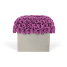 Square box with a scalloped purple rose top on a white background