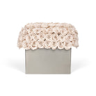 Floral arrangement in a box on a white background